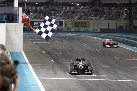 Kimi Raikkonen crosses the finish line, grand prize of abu dhabi 2012 F1 Finish Line, F1 2013, Abu Dhabi Grand Prix, United States Grand Prix, Kimi Raikkonen, Nico Rosberg, Michael Schumacher, Popular Sports, Travel Info