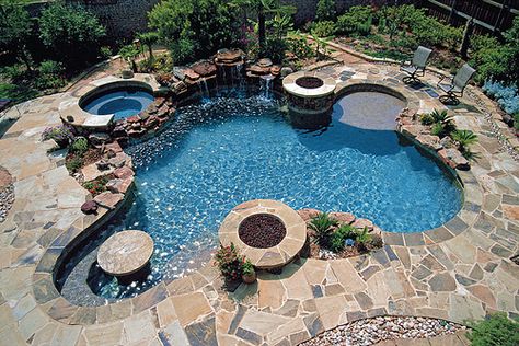 This is the perfect pool! ...hot tub area, eat up bar area, firepits, "deep end" area, a shallow tanning ledge, AND a waterfall.  Maybe one day... :) Ideas De Piscina, Diy Outdoor Decor, Dream Pools, Pool Bar, Dream Backyard, Cool Pools, Backyard Oasis, Pool Designs, Backyard Pool