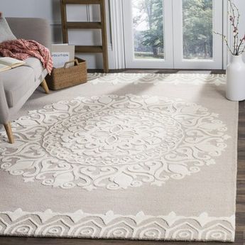 If your downtime consists of chasing littles ones and fur babies in the living room or serving your famous lasagna in a formal dining room, welcome in the feeling of home with a beige and ivory floral medallion pattern. Hand-tufted from 100% wool, its high-low pile means it’s easy to clean and allows doors to swing by freely in your high-traffic areas. Let its antiqued finish become the focal point of your master bedroom, then top it with a tufted settee and a faux fur blanket draped over the to Braided Rug Diy, Ivory Area Rug, Diy Rug, Ivory Rug, Formal Dining Room, Contemporary Area Rugs, Beige Rug, White Area Rug, Floral Rug