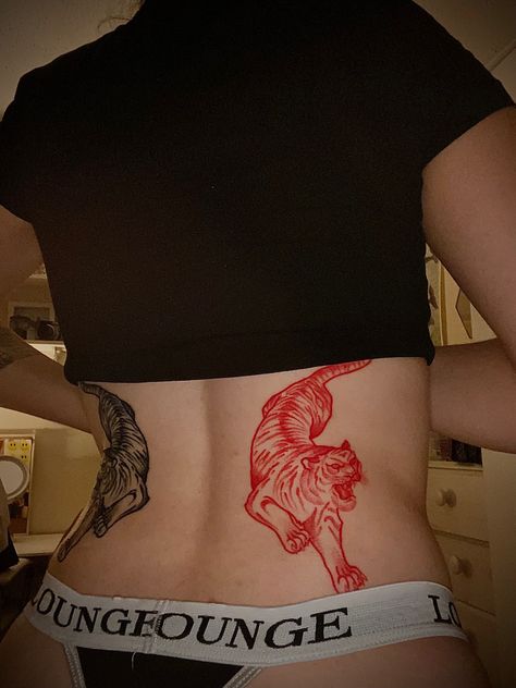 Tiger On Back Tattoo, Tiger Lower Back Tattoo Women, Red Tiger Tattoo On Back, Big Cat Back Tattoo, Red And Black Tiger Tattoo, Tiger Belly Tattoo, Red Tiger Tattoo, Tiger Waist Tattoo, Black Tiger Tattoo