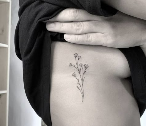 Delicate Flower Rib Tattoo, Birth Flower On Ribs, Dainty Flower Tattoos Rib, Dainty Wildflower Tattoo Ribs, Side Rib Flower Tattoos Women, Flowers On Side Tattoo, Fine Line Flower Rib Tattoo, Simple Tattoos Ribs, Birth Flower Tattoos On Ribs