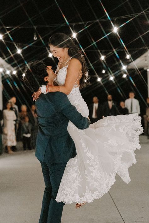 Bride and Groom Dance First Dance - With joy and affection, the groom sweeps his new bride up into his arms on the dance floor, lifting her off her feet and twirling her around as they sway and laugh together, cherishing their first dance as newlyweds at their magical wedding reception. Bride And Groom Pictures Reception, Groom Spinning Bride, Bride And Groom First Dance Photos, Bride And Groom Reception Photos, First Dance Photography, Wedding First Dance Photos, First Dance Wedding Photos, Wedding Dance Photos, Bride And Groom Dance