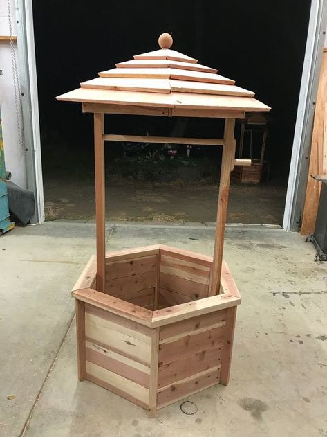 I have always wanted a wishing well in my yard but it was always lower on the priority list than some of my other projects. Well, I volunteered to create the class project for my daughter's school auction and in trying to come up with an idea for what to build, I thought of a wishing well. It's the perfect yard decor, and by building one for the school auction, I could build one for myself at the same time! ;-) Here are the abbreviated instructions for how I built my magical wis… Diy Wishing Well, Diy Wishing Wells, Woodworking Plans Toys, Woodworking Plans Patterns, Wishing Wells, Wood Crafting Tools, Woodworking For Kids, Woodworking Patterns, Plan Toys