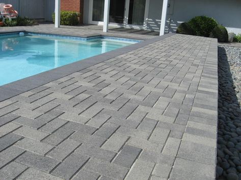 Pool Deck Pavers | Ocean Pavers Inc Dark Pavers Around Pool, Concrete Pavers Pool Deck, Pool Deck Pavers, Paver Pool Deck, Deck Pavers, Pavers Design, Paver Deck, Pool Pavers, Patio Pavers Design