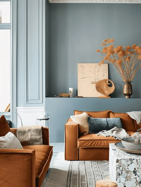 What Colors Go With A Rust Color Scheme In Your Home? [17 Color Ideas You Will Love!] Rust Furniture Living Room, Light Blue And Terracotta Living Room, Beige And Terracotta Living Room, Analogous Color Scheme Interior Design, Rust And Cream Living Room, Living Room With White Floor, Blue And Orange Living Room Color Scheme, Bright Interior Paint Colors, Living Room Color Scheme Ideas Bright