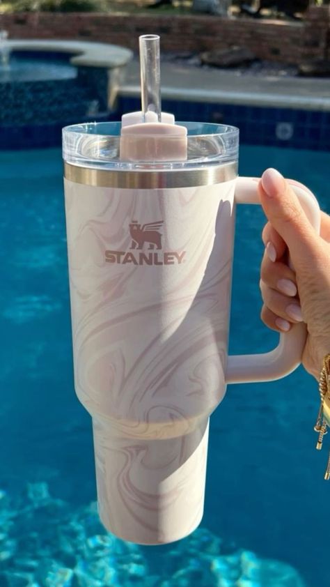 Introducing the perfect companion for your morning brew ☕! This insulated Stanley coffee cup keeps your drink hot or cool for hours, so no more lukewarm sips! Say goodbye to disposable cups and help the environment 🌍. With a spill-proof lid, it's perfect for on-the-go. Enjoy your coffee at the perfect temperature while reducing waste. #CoffeeLovers #ReusableCup #MorningFuel #Sustainability #HotCoffee #IcedCoffee #Stanley #Tumbler #Sustainablity #SaveThePlanet #AutumnEssentials #FallEssentials Stanley Water Bottle, Stanley Products, Trendy Water Bottles, Cute Coffee Cups, Coffee Smoothie, Cute Water Bottles, Pretty Cups, Stanley Quencher, Starbucks Cup