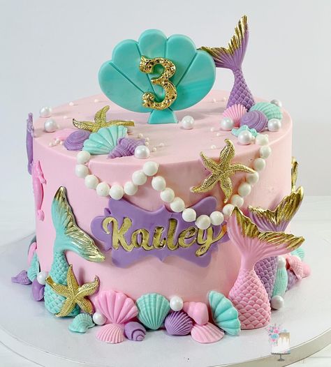 Mermaid-themed birthday cake with edible mermaid tails and pearls in pastel hues Mermaid Birthday Party 3rd Birthday, Mermaid 5th Birthday Cake, Mermaid Cakes For Girls Birthday, Little Mermaid Birthday Party Cake, 3rd Birthday Party Theme Ideas, The Little Mermaid Cake, Under The Sea Birthday Cake, 3rd Birthday Party For Girls, Mermaid Birthday Cake