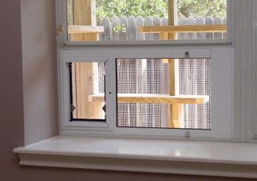 The Cat Carpenter Catios - There are several types and sizes of high quality window inserts that make it easy to add a cat door. Catio Window, Cat Door Diy, Catio Ideas, Cat Habitat, Cat Toilet Training, Cat Enclosures, Cat Patio, Outdoor Cat Enclosure, Window Inserts