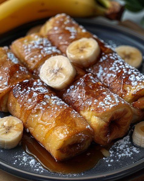 Just whipped up these Banana French Toast Roll-Ups! Perfect for a sweet start to your day. Visit website for full recipes at https://northeastnosh.com/f/banana-french-toast-roll-ups #northeastnosh #breakfastdelight #brunchideas #frenchtoastrecipe #sweetbreakfast #bananarecipes #easycooking #kidfriendlyfood #homemadegoodness #quickmeals #comfortfood #sweettreat #cinnamonflavor #sugarrush #morningtreat #deliciousstart French Toast Board, Nana Pudding, Crusted French Toast, Toast Board, Toast Roll Ups, French Toast Roll Ups, French Toast Rolls, Banana French Toast, French Toast Breakfast