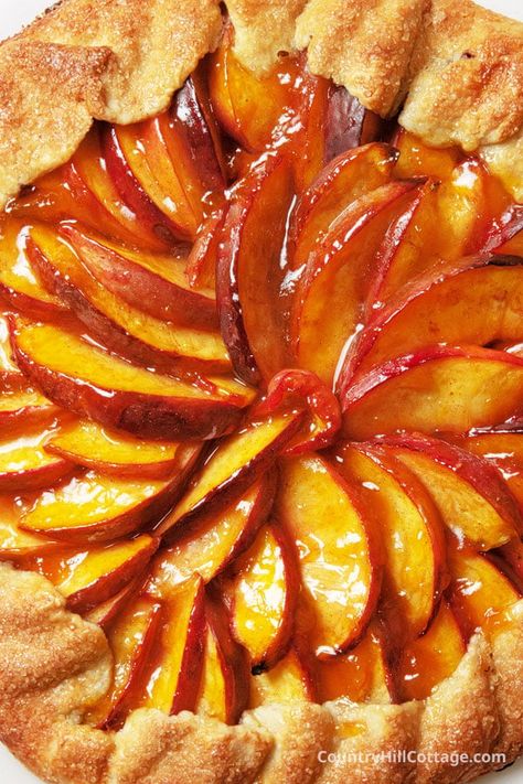 This pretty homemade nectarine galette combines a flaky, rustic pie crust with cinnamon and vanilla-spiced nectarines. Easier than pie yet just as delicious, this simple summer dessert recipe comes together with a few simple ingredients and easy steps and can be adapted to whatever seasonal fruit you have at hand. As impressive as this dessert looks, it’s really simple to make. Just follow the step-by-step instructions, and you’ll have no trouble making this dish. | CountryHillCottage.com Nectarine Galette, Rustic Pie, Best Deserts, Nectarine Recipes, Dessert Cheesecake, Cake Snack, Galette Recipe, Fun Deserts, Seasonal Fruit