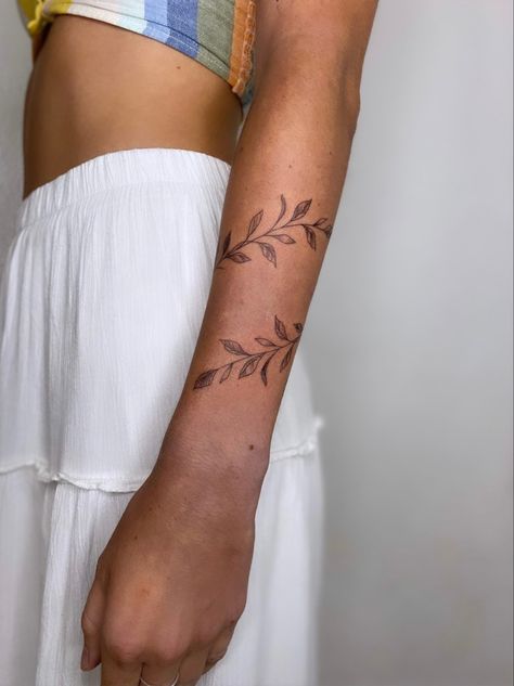 Leafy, vine, wrist wrap tattoo Arm Ivy Tattoo, Wrap Around Vines Tattoo, Vine Around Forearm Tattoo, Flower Filler Tattoo Sleeve, Christian Wrap Around Tattoo, Vibe Wrap Tattoo, Olive Branch Band Tattoo, Leafy Wrap Around Tattoo, Colored Vine Tattoo