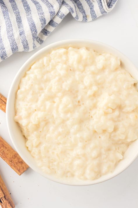 Rice pudding is a classic comfort food that has been enjoyed for generations. It's a simple dish, often made with ingredients you already have in your Rice Pudding In Crockpot, Easy Rice Pudding With Cooked Rice, Rice Pudding Crockpot, Quick Rice Pudding, Crockpot Rice Pudding, Slow Cooker Rice Pudding, Homemade Rice Pudding, Baked Rice Pudding, Slow Cooker Rice