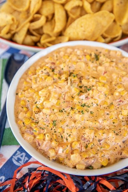 Warm Spicy Corn Dip - SOOOO good! Corn, cream cheese, cumin, chili powder, garlic, and Rotel tomatoes. Ready in under 10 minutes. Can make on the stove, in the microwave or in the crockpot. Great for parties! There is never any left!! #partyfood #dip #tailgating #holiday #microwave #crockpot Warm Corn Dip, Corn Cream Cheese, Spicy Corn Dip, Thanksgiving Party Food, Football Food Appetizers, Mexican Corn Dip, Corn Cream, Hot Corn Dip, Football Friday