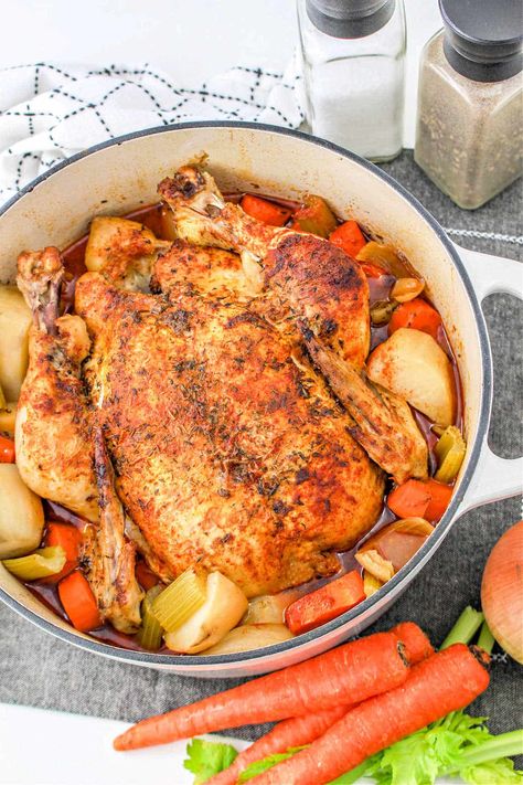 Dutch Oven pot roast chicken in the oven with vegetables is a delicious healthy meal. Seasoned whole chicken with a delicious dry rub. Dutch Oven Whole Chicken Recipes One Pot, Dutch Oven Whole Chicken And Vegetables, Dutch Oven Roast Chicken Recipes, Roast Chicken From Frozen, Whole Chicken Recipes With Vegetables, Cast Iron Whole Chicken Recipes, Whole Roasted Chicken And Vegetables, Whole Chicken In Cast Iron Dutch Oven, Roasted Chicken Whole Crock Pot