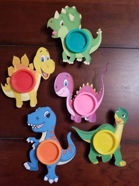 These cute Dinosaur Birthday Play-Doh Party Favors cards, make a great and different party favor. They also make great classroom gifts, or even just for a rainy day activity. Each bag includes the following and is good for one child: - personalized bag topper with child's name and age - 1 Dino Play-Doh cardstock holder - 1, 1 oz. Play-doh container PLAY-DOH COLORS WILL VARY PER BAG OR DINO CARD Please feel free to message me with any questions. WE CAN CUSTOMIZE YOUR PARTY BY CREATING DIFFERENT T Cute Dinosaur Birthday, Play Doh Party, Dinosaur Favors, Dinosaur Birthday Party Decorations, Dinosaur Play, Kids Party Favors, Dinosaur Party Favors, Dinosaur Themed Birthday Party, Dino Birthday Party