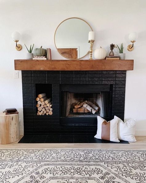 a stylish black brick fireplace with a built in firewood niche, a stained mantel with elegant decor is a gorgeous idea to try Black Brick Fireplace, Moody Living Room, Painted Brick Fireplaces, Brick Fireplace Makeover, Black Fireplace, Faux Fireplace, Fireplace Remodel, Diy Fireplace, Home Fireplace