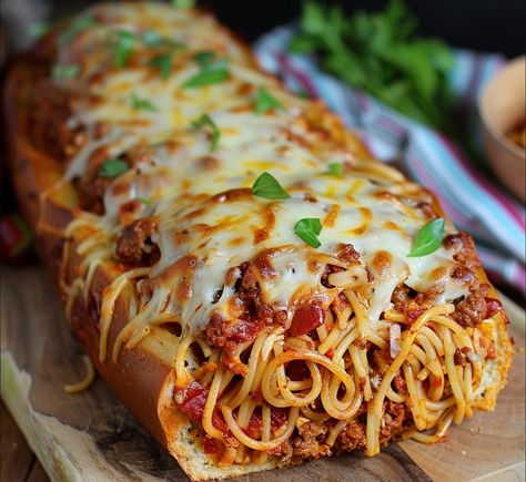 Introducing Spaghetti-Filled Garlic Bread: A tantalizing fusion of two beloved classics, this recipe takes the humble garlic bread to new heights by filling it with hearty spaghetti and gooey mozzarella cheese. With each bite, you’ll experience the perfect harmony of crunchy bread, savory spaghetti, and melty cheese, all enveloped in a fragrant blend of garlic, […] Garlic Bread Spaghetti, Spaghetti Bread, Crunchy Bread, Cheese All, Slow Cooked Chicken, Baked Garlic, Melty Cheese, Delish Recipes, Sausage Pasta