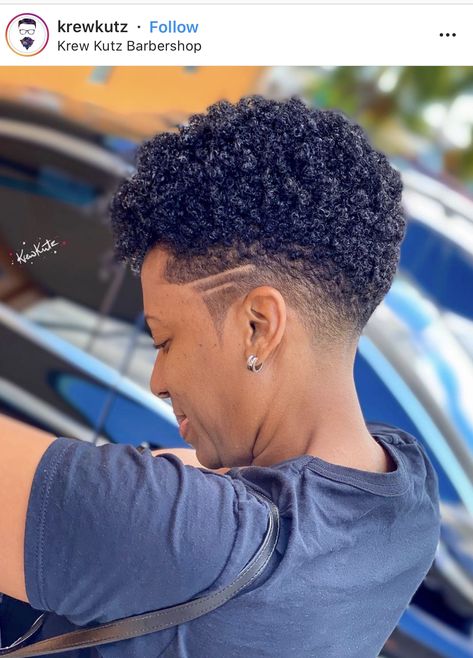 Short Shaved Sides Hairstyle Black Women, Short Mohawk Fade For Black Women, Womens Natural Fade Haircut, Taper Fade Curly Hair Black Women, Taper Fade Haircut Black Women, Mohawk Tapered Fade Black Women, Temp Fade Haircut Women, Faded Tapered Haircut Women, Taper Fade Haircut Women Black Design