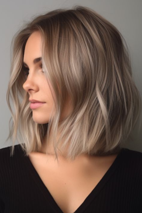 For a chic yet easy-to-maintain hairstyle, opt for a long bob with textured ends. The wispy texture of the ends creates an airy feel for achieving that tousled and beachy look. Click here to check out more why the bouncy bob is making a comeback: see 28 fabulous examples. Boss Babe Haircut, Sandy Blonde Long Bob, Bobs With Texture, Long Bob Blonde Balayage Dark Roots, Long Messy Bob Hairstyles, Bob With Light Layers, Fine Hair Blonde Bob, Lob Haircut Blonde Balayage, Blond Long Bob Hairstyles