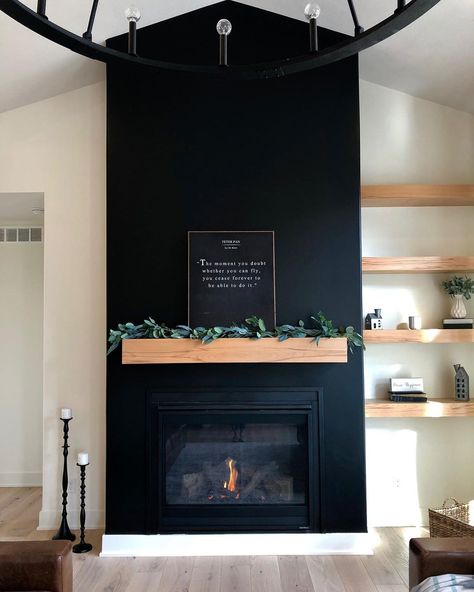 35 Amazing Black Fireplace Ideas To Inspire You Right Away Black Wall Wood Mantle, Black Electric Fireplace Living Room, Black Drywall Fireplace, Art Wall With Shelves, Black Fireplace With Taupe Walls, Dark Fireplace Accent Wall, White Walls With Black Fireplace, Black Fireplace Design, Black Stone Fireplace Wall