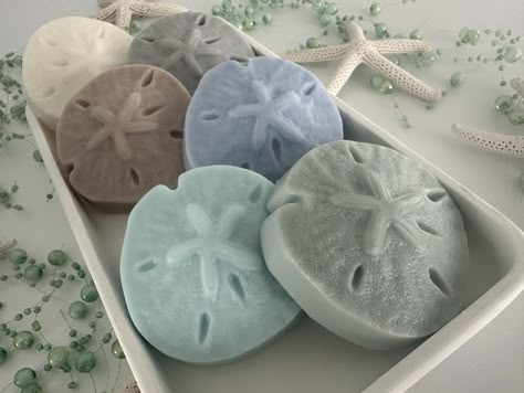 "Add a beachy, tropical feel to your next party with these fascinating sand dollar-shaped Shea Butter and Goat Milk soaps. Perfect for any beach-themed event, these soaps come in a selection of over 10 soft tropical colors and over 50 inviting soft scents. It's the perfect reminder of a summer beach holiday for your guests! The purchase of this listing is for FIVE sand dollar-shaped soaps with the following specifications: - Each soap measures 3 x 3 x 1\" and weighs 2.5-3 oz. - Available in a multitude of soft tropical colors.  You'll receive five soaps in the same color chosen from the dropdown menu for every set you purchase. - Crafted with creamy Shea Butter and Goat Milk for a skin-friendly experience. - A choice from over 50 refreshing soft scents to make your beach party unforgettabl Beachy Birthday, Ocean Room Decor, Diy Room Decor For Teens, Key West Wedding, Beach Themed Party, Fun Crafts To Do, Tropical Colors, Beach Wedding Favors, Sand Dollar