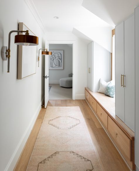 When redesigning this family home, this hallway to a guest suite could have been easily forgotten. With a partially sloped ceiling and ample area, our team saw an opportunity to create much needed extra storage space and visual interest. Now, it serves as a reading nook while adding visual appeal to an often overlooked space.⁠ ⁠ #livableluxury #charlestoninteriordesign #charlestoninteriors #houserenovations Sloped Ceiling Hallway, Wood Slat Ceiling Hallway, Hallway With Skylight, Skylight In Hallway, Hall Skylight, Hallway Skylight, Charleston Interior Design, Easily Forgotten, Green Walls Living Room