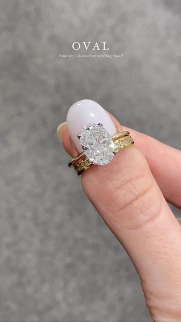 Engagement rings Hatton Garden jewellers on Instagram: "Such a stunning bridal set!😍 This magnetic duo features a Oval Cut Juliet Engagement Ring and a sparkling channel set wedding band 💍 Follow us for daily inspiration! ❤️" Tall Setting Oval Wedding Ring Set, High Set Oval Engagement Ring With Wedding Band, Luxury Oval Stackable Wedding And Engagement Rings, Gold Wedding Bands Women With Oval Engagement Ring, Channel Setting Wedding Band, Channel Set Engagement Rings Oval, Channel Wedding Band And Engagement Ring, Oval Channel Set Engagement Ring, Chanel Set Wedding Band