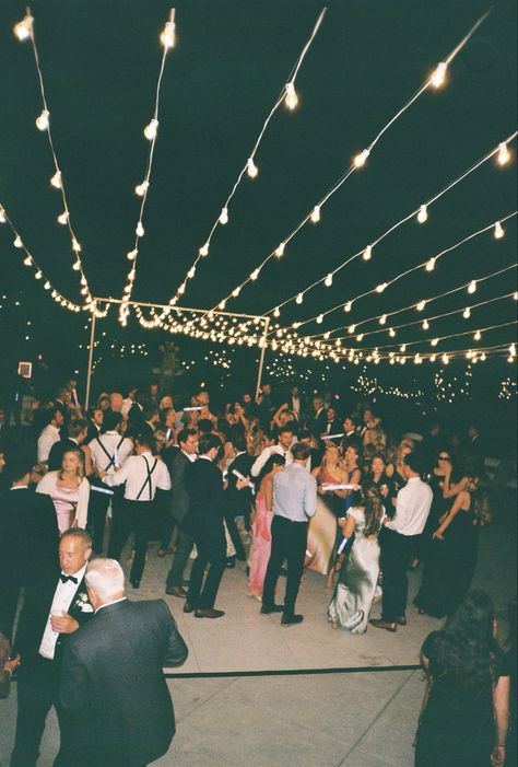 Wedding dance floors adorned with string lights create a magical and inviting atmosphere, perfect for celebrating under a soft, romantic glow. The twinkling lights suspended overhead add a whimsical touch, making the space feel intimate and enchanting. Combined with the lively energy of the dance floor, this setup brings warmth and elegance to any wedding reception. #WeddingDanceFloor #StringLightsMagic #RomanticWeddingVibes #EnchantedReception #WhimsicalWeddings #DanceUnderTheLights #MagicalWeddingNights #WeddingDecorGoals #TwinklingLights #ElegantWeddings Twinkle Lights Over Dance Floor, Outdoor Dancefloor, Wedding Dance Floors, Wedding Reception Dance Floor, Outdoor Dance Floors, Wedding Dance Floor, Dancing Wedding, Wedding Reception Lighting, Dance Floor Wedding