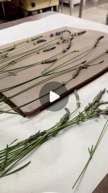 Christine Stangel on Instagram: "Lavender is my most favorite flower of all time! Plus, the lovely aroma that fills my studio after pressing them into clay is unbelievable. Charcuterie boards with imprinted lavender from my very own garden…  coming soon!  #csstangelpottery" Pressing Flowers Into Clay, Flower Imprints In Clay, Pressing Lavender, Pottery Charcuterie Board, Ceramic Charcuterie Board, Clay Imprints, Texture Pottery, Surface Decorations, Pottery Texture