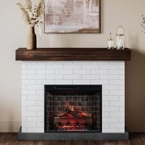 PRICES MAY VARY. INCLUDES ELECTRIC LOG SET FIREBOX: The smart 28 inch electric fire box fits perfectly into the mantel surround and also pairs with the Tuya Smart App or with the Google Assistant/Amazon Alexa. FAUX BRICK: The charming white finish on the faux brick creates a timeless aesthetic and farmhouse style to your living space. REALISTIC LOGS AND EMBER BED: The realistic resin logs and glowing ember ashbed offer a cozy, life-like experience. Feel free to set a timer for 1-9 hours of conti Electric Fireplace With Mantel, Wood Mantel, Mantel Surround, Gas Fireplace Insert, Fireplace Heater, Electric Fireplace Insert, Fireplace Insert, Wood Mantels, Wall Mount Electric Fireplace