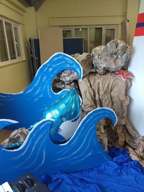 Lighthouse theme Breaker Rock Beach Stage Decorations, Sandcastle Cove Vbs, Cardboard Lighthouse, Cardboard Waves, Vbs Diy, Halloween Booth, Vbs Ocean Theme, Lighthouse Theme, Ocean Vbs