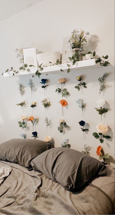 Pastel flower wall hanging from white shelf with light grey wall behind. Pastel Flower Bedroom, Daisy Room Aesthetic, Flower Dorm Decor, Modern Cottage Core Bedroom Aesthetic, Wildflower Bedroom Aesthetic, Flower Dorm Room Ideas, Cottage Core Bedroom Wall Decor, Flowery Bedroom Aesthetic, Dorm Room Ideas Cottagecore