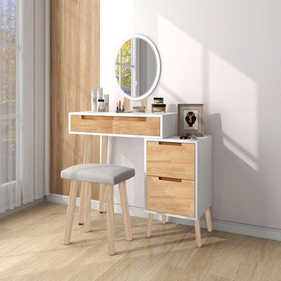 This vanity set comes complete with a cushioned stool and touchscreen adjustable mirror to help you get ready in the morning. It's made from solid and engineered wood with a two-tone white and rustic light brown finish. The table rests on splayed legs, giving your bedroom or guest room a hint of mid-century modern style. It also features two drawers with cut-out handles that are just right for makeup, brushes, and jewellery. An upholstered linen cushion on the stool keeps you comfy while you do your routine. Plus, the mirror in this set features a round silhouette that offers the right amount of light. Full assembly is required. | George Oliver Vanity Desk w/ 3 Adjustable Lighting Modes Mirror, w/ 5 Drawers & Cushioned Stool, Adjustable Storage Cabinet | C111266647 | Wayfair Canada Rustic Light, Mirrored Vanity Desk, Vanity Table Set, Large Vanity, Small Space Bedroom, Bedroom Size, Make Up Desk Vanity, Small Vanity, Vanity Desk