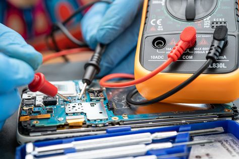 Technician repairing inside of mobile phone by soldering iron. Integrated Circuit. the concept of data, hardware, technology. Healthy Face, Integrated Circuit, Soldering Iron, Face Skin, Soldering, Circuit, Mobile Phone, Repair, Stock Photos