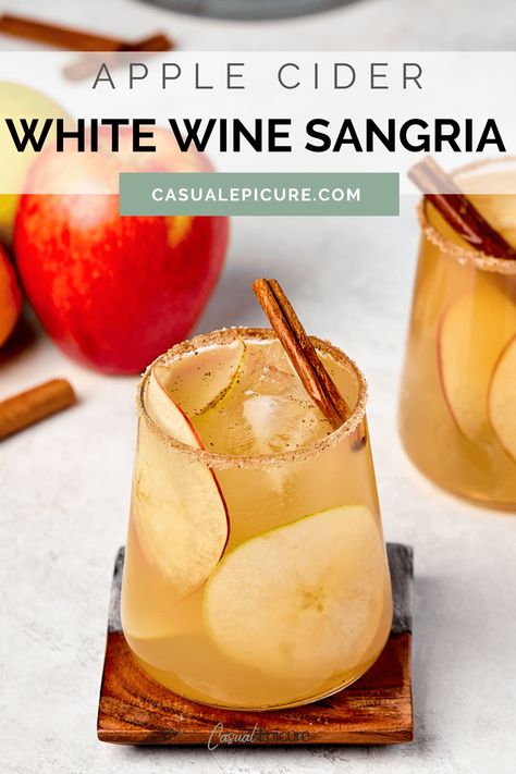 Looking for the perfect fall cocktail? This Apple Cider White Wine Sangria is your answer! It's a fresh take on traditional sangria that combines white wine, apple cider, and brandy for a taste that screams autumn. Easy to make by the pitcher, it's perfect for everything from Thanksgiving to holiday parties! Apple Wine Sangria, Apple Cider Whiskey, Easy Sangria, White Wine Sangria Recipe, Types Of White Wine, White Sangria Recipe, Easy Sangria Recipes, Cider Mimosas, Apple Cider Mimosa