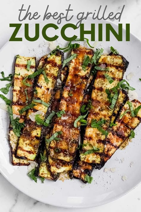 This grilled zucchini is great hot off the grill or at room temperature. Learn how to grill zucchini with Parmesan to add a tasty twist to this summer classic. Grilled Zucchini And Tomatoes, Balsamic Grilled Zucchini, Zucchini Bbq Grilled, Squash Grilling Recipes, Grilled Side Recipes, Grilled Zucchini And Peppers, Grilled Zucchini And Carrots, Grilled Zucchini With Feta, Grilled Zucchini Recipes Bbq