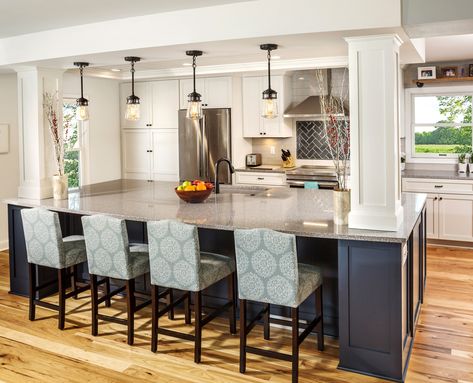 A very large 12’x5’8” Engineered quartz countertop by Caesarstone was selected in a Pebble color with a high gloss finish. The homeowners were excited to move the sink to the island and incorporate a durable Blanco Silgranit undermount sink in a matching Truffle color. A Delta Pull-down faucet with a Venetian Bronze finish matches the bronze hardware and pendant lights. Kitchen Island Ideas With Columns, Kitchen W Island, Kitchen Island With Post, Kitchen Island With Columns, Kitchen Columns, Open Concept Kitchen Living Room, Open Concept Kitchen And Living Room, Open Plan Kitchen Dining Living, Pebble Color