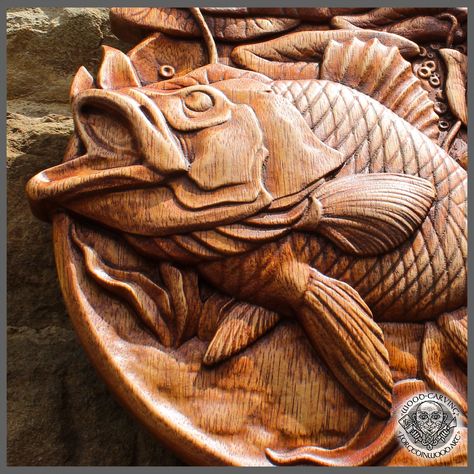 CARP - Graceful wood carving picture. MATERIAL: Iroko wood and antique wax SIZE: 10.5 x 10.5 inches, 27 x 27 cm -------------------------------------------------------------------------------------- Here, in our Hall of Animals, do not be lured into a false sense of security by the gentle buzz of hummingbird wings, as these tiny creatures drink in the sweet nectar of wildflowers. For here, too, is the roar of the grizzly, the howl of the wolf, and the screech of the raven. In this Hall, watch fo Fish Wood Carving, Hummingbird Wings, Fish Carving, Iroko Wood, Tiny Creatures, Cabin Rustic, Wooden Rabbit, Antique Wax, Wood Wax