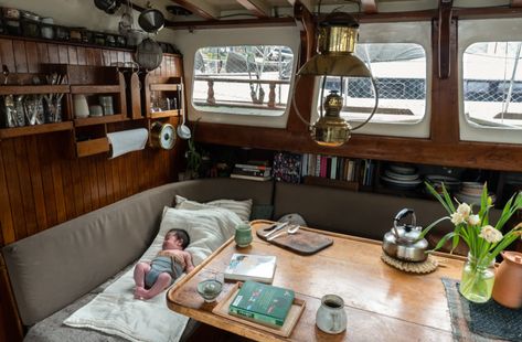 This family lives on their sailboat. Here’s how they make it work Sailing Boat Interior Ideas, Living On A Boat Aesthetic, Sailboat Living Interiors, Houseboat Aesthetic, Live Aboard Sailboat, Small Sailboat Interior, Pilothouse Sailboat, House Boat Interior, Houseboat Decor