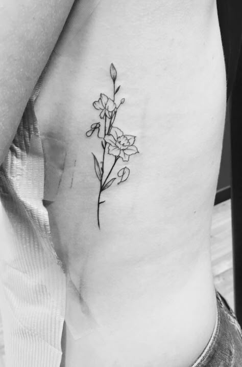 Narcissus & Sweet pea flower tattoo birth flowers #narcissus #sweet pea #flower #tattoo #minimalist #ink #initials #ribtattoo Dainty December Flower Tattoo, Narcissus And Sweet Pea Flower Tattoo, Sweet Pea And Narcissus Tattoo, Sweet Pea And Daffodil Tattoo, Daffodil And Sweet Pea Tattoo, Minimalist Narcissus Tattoo, Sweet Pea Bouquet Tattoo, Paperwhite Flower Tattoo, Narciss Flower Tattoo