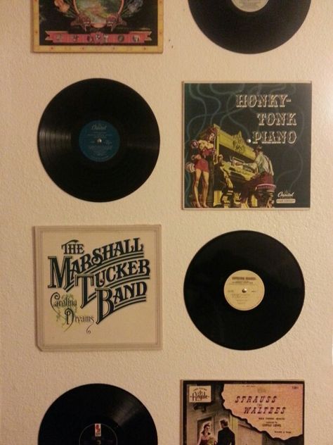 Made this today :] cheap thrift store vinyl records at 50 cents a piece and tacks. Fun way to decorate a wall on the cheap!! could be great for a college dorm room Store Vinyl Records, Record Display, Retro Bedrooms, Tumblr Rooms, Retro Room, Dekorasi Kamar Tidur, Vinyl Storage, Vintage Bedroom, Music Decor