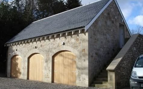 Stone Garage Exterior, Arched Garage Doors, Stone Carriage House, Arched Barn Door, Stone Shed, Stone Garage, Port Cochere, Carriage Garage, Timber Garage