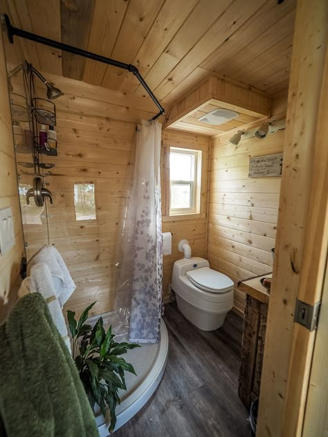 The bathroom includes a custom shower with acrylic clear walls and black pipe shower curtain rail, Separett composting toilet, and waterproof vinyl flooring. Gooseneck Tiny House, Apartemen Studio, Casa Hobbit, Tiny House Interior Design, Bathroom Shower Design, Tiny House Inspiration, Tiny House Bathroom, Shed Homes, Tiny House Movement