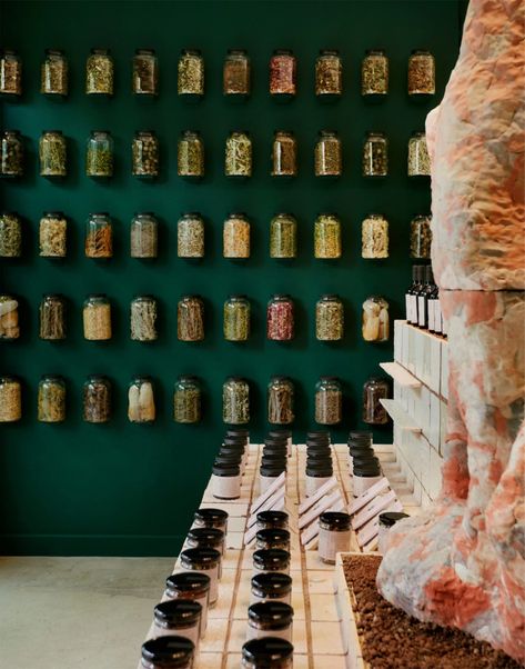 Rammed-earth counter anchors Flamingo Estate pop-up in Los Angeles Nuts Store Interior Design, Flamingo Estate Branding, Scaffolding Architecture, Nut Store, Apothecary Shoppe, Green Moodboard, Apothecary Design, Flamingo Estate, Moroccan Aesthetic