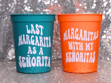 Bottoms up! Have your whole vineyard loving bachelorette crew drinking in style with these MARGARITA themed plastic stadium cups.  🆃🅾  〰️Choose the amount, design and color of the cups you would like to order.  〰️Designs: MARGS AND MATRIMONY, LAST MARGARITA AS A SENORITA, or MARGARITAS WITH MY SENORITAS. 〰️Don't forget to purchase a white cup for the bride! 〰️Scroll through the product listing's photos for cup colors and shipping options.   〰️Each stadium cup holds 16 oz of your favorite party Bachelorette Party Ideas Margaritas, Bachelorette Party Margs And Matrimony, Bachelorette Margs And Matrimony, Marks And Matrimony Bachelorette Party, Margarita Party Theme, Matrimony And Margs Bachelorette Ideas, Margs And Matrimony Hens Theme, Last Margarita As A Senorita, Margarita And Matrimony