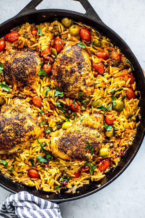 One-Pan Chicken Puttanesca with Creamy Orzo is a beautiful meal, and it's simple enough for your weeknights. #onepan #onepot #chicken #orzo #puttanesca #weeknightdinner #easydinner #familydinner #chickenthighs One Pan Tuscan Orzo With Chicken, Chicken Thigh Recipes With Orzo, One Pan Chicken Orzo Bake, Orzo Tuscan Chicken Bake, One Pan Chicken Orzo Recipes, Chicken Puttanesca, Spinach Tomato Pasta, Tomato Pasta Bake, Creamy Orzo