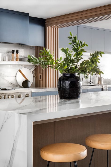 Porcelain and black marble waterfall island.  Wood paneling to cover piping in the kitchen.  Moody and dark kitchen cabinets. Surf Family, Curated Kitchen, Lindye Galloway, Dark Kitchen, Coastal Contemporary, Contemporary Coastal, Coastal Modern, California Surf, Modern Beach House