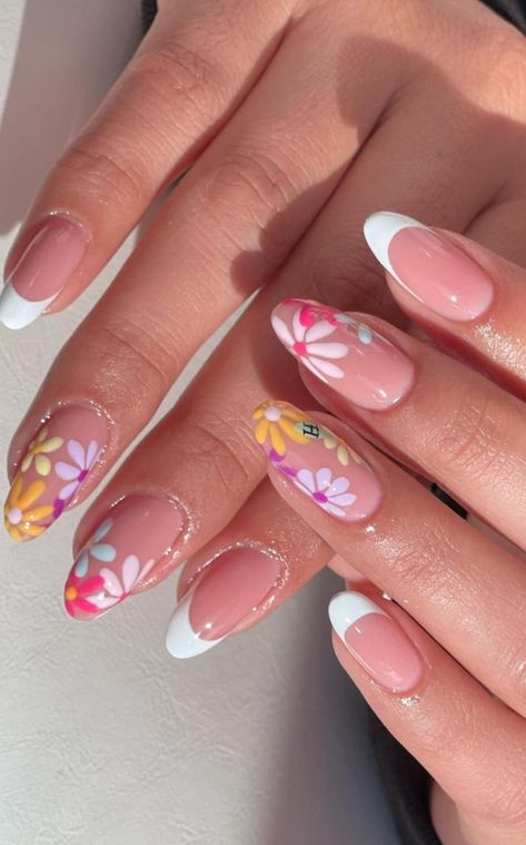 Looking for some flower nail designs? Check out this list of 35+ simple and cute flower nails! Perfect for gel, acrylic, and natural nails. From beautiful French tips to vibrant pink, white, blue, yellow, and green hues, these floral nail designs will add a touch of beauty to your fingertips. Plus: spring nails, summer nails.  (📷 nails_by_cnd IG) Clear Nail Designs With Flowers, Single Flower Nail Design, French Manicure Flower Designs, Floral Nails French Tip, May Flower Nails, Colourful Flower Nails, Nails For Europe Vacation, Nail Floral Designs, Gel Nail Designs 2024