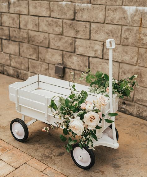 DIY project spray paint Radio Flyer wagon all white, white wagon, wedding wagon with flowers, flower wagon, wedding dog wagon Wagon For Ring Bearer Cute Ideas, Flowergirl Wagon Ideas, Decorate Wagon For Wedding, How To Decorate A Wagon For A Wedding, Flower Girl Wagons, Wagon Wedding Ring Bearer, Wedding Wagon Ideas, Flower Wagon Ideas, Wagon Decorated For Wedding