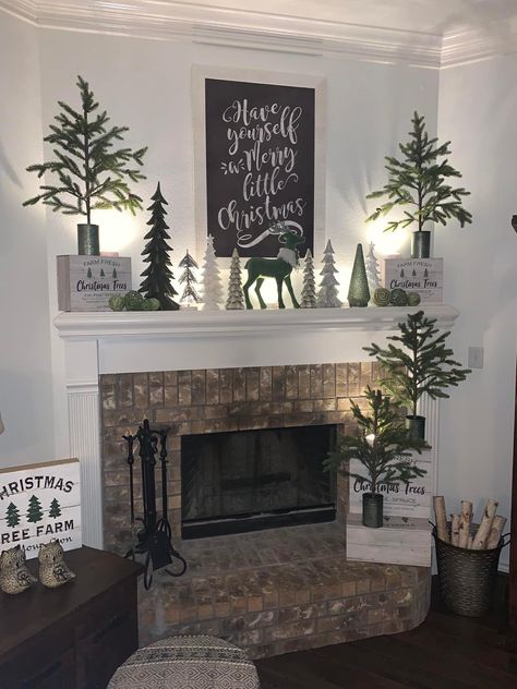 Christmas Fireplace With Deer, Christmas Trees On Mantle, Christmas Mantel Decorating Ideas Rustic, Fireplace Wall With Tv, Christmas Fireplace Mantle Decorations, Farmhouse Christmas Mantle, Xmas Signs, Fireplace Tv Wall Decor, Black Christmas Decorations